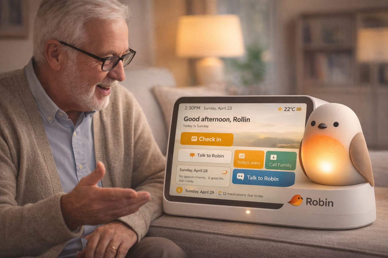 Elderly man smiling at the Robin companion device showing the home dashboard
